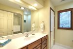 Hallway bath with single sink and combination tub/shower